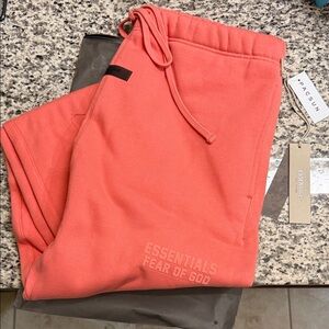 Fear of God Essentials Coral/Salmon Sweatpants